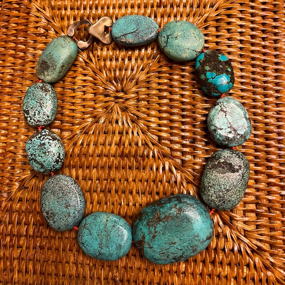 Turquoise stone choker necklace done by local jeweler “Catala”.